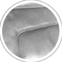 A close-up of a car surface with visible fading, highlighting the importance of protection against discoloration and wear.