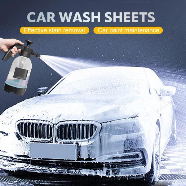 A luxury car covered in thick foam while being sprayed with a cleaning solution from a pressure sprayer, demonstrating the effectiveness of car wash sheets.