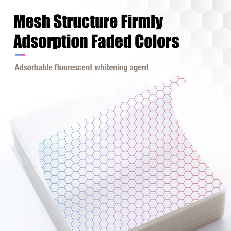 A close-up view of colour catcher sheets featuring a hexagonal mesh structure, demonstrating their strong dye absorption technology. The design highlights the adsorption of faded colours and fluorescent whitening agents for cleaner, brighter laundry.