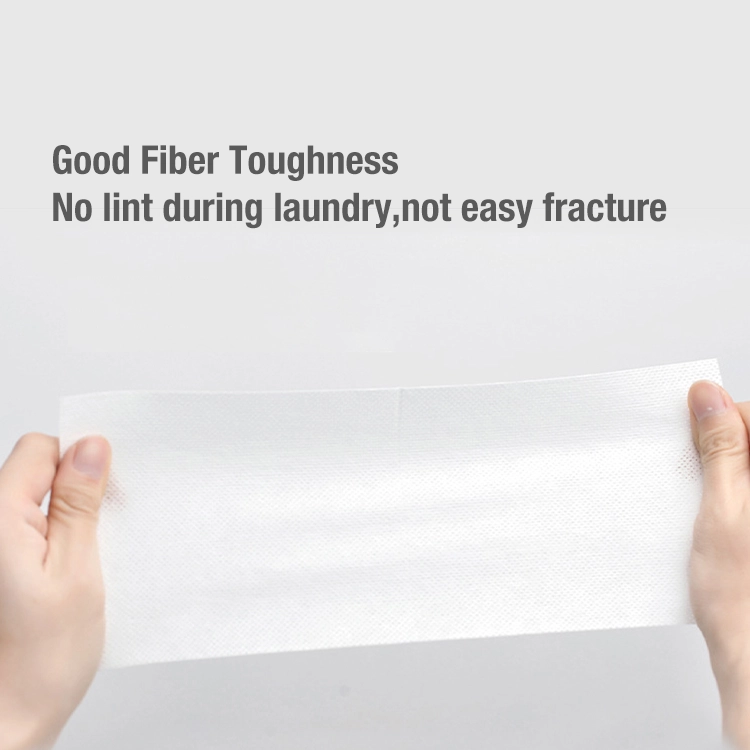 A person stretching a colour catcher sheet, showcasing its strong fiber toughness, tear resistance, and lint-free properties for effective laundry use.