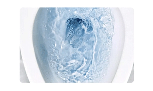 A toilet being flushed, with clean blue water swirling inside the bowl after using a cleaning sheet.