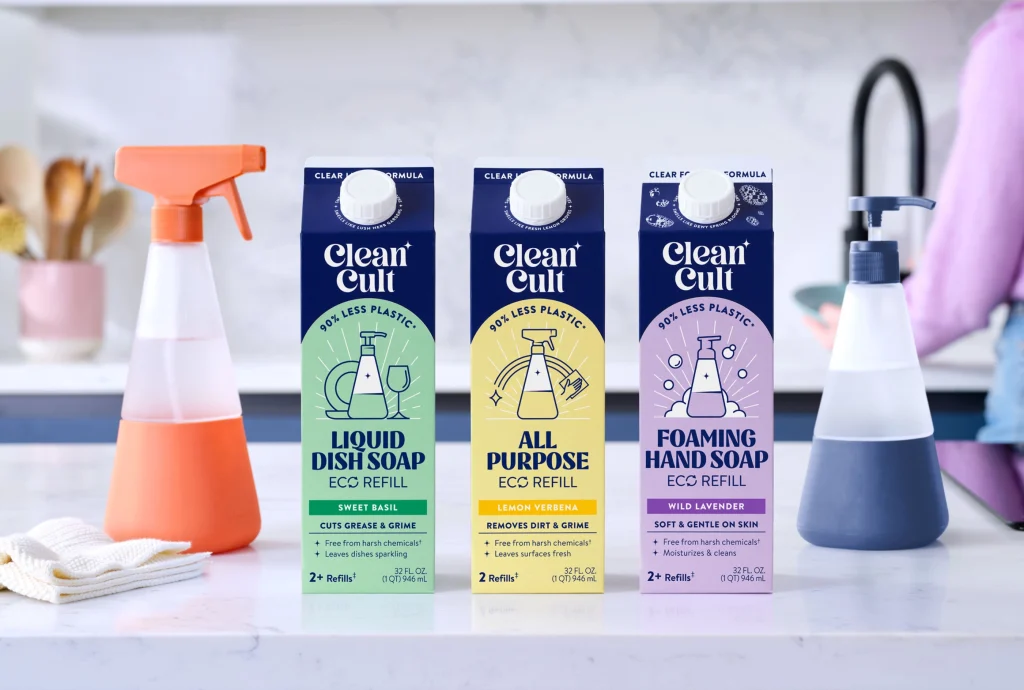 Cleancult eco-friendly liquid dish soap, all-purpose cleaner, and foaming hand soap in sustainable refill cartons displayed on a kitchen counter.